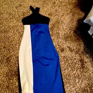 Bebe dress is strech and in black, blue and white brand new never worn